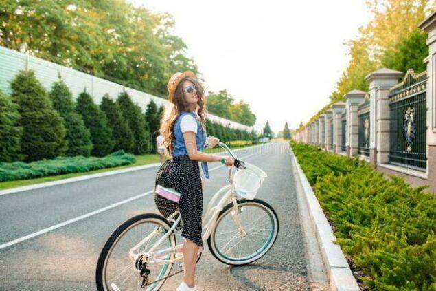 Skirt Cycling beauty as the featured image for VIDA E Plus - The Best Affordable Urban e-bike for females post.