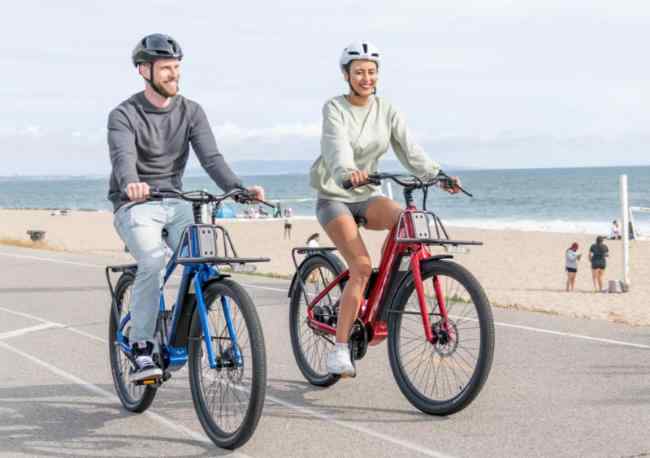 The couple goes for a leisurely ride along the beach.